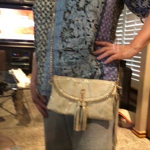 Gold metallic envelope evening bag.